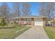 Charming brick ranch home featuring an attached garage and front yard at 417 Judy Dr, Goose Creek, SC 29445