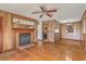 Open-concept living room with hardwood floors and cozy fireplace at 417 Judy Dr, Goose Creek, SC 29445