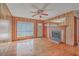 Spacious living room with hardwood floors, fireplace, and wood paneling at 417 Judy Dr, Goose Creek, SC 29445