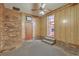 Living room with brick fireplace and door leading to another room at 417 Judy Dr, Goose Creek, SC 29445