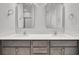 Bathroom vanity featuring double sinks, white quartz countertops, and dual rectangle mirrors at 419 Grove End Rd, Moncks Corner, SC 29461
