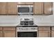 Modern range and microwave with stainless steel appliances, and ample cabinet space at 419 Grove End Rd, Moncks Corner, SC 29461