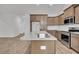 Kitchen with stainless steel appliances, a granite island, and wood cabinets at 419 Grove End Rd, Moncks Corner, SC 29461