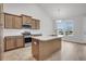 Kitchen with stainless steel appliances, a kitchen island, and wood cabinets at 419 Grove End Rd, Moncks Corner, SC 29461