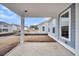 Covered patio with concrete floors and a view of the backyard and nearby homes at 419 Grove End Rd, Moncks Corner, SC 29461