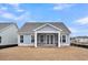 Back of house featuring screened in porch and a view of the backyard at 419 Grove End Rd, Moncks Corner, SC 29461