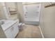 Bathroom featuring a white vanity, toilet, and tub with shower, complemented by tile flooring at 431 Eva St, Moncks Corner, SC 29461