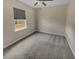 Bright bedroom with neutral carpet, ceiling fan and window allowing ample natural light at 431 Eva St, Moncks Corner, SC 29461