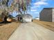 Charming home with a well-manicured front yard and a spacious driveway leading to an attached two-car garage at 431 Eva St, Moncks Corner, SC 29461