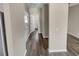 Hallway with wood-look flooring, doors, and access to other rooms in the home at 431 Eva St, Moncks Corner, SC 29461