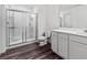 Clean bathroom featuring a glass door shower, modern fixtures, and wooden floors at 458 Pender Woods Dr, Summerville, SC 29486