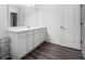 Bathroom with a long vanity, wood-look flooring, and a door to the toilet at 458 Pender Woods Dr, Summerville, SC 29486