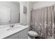 Bright bathroom featuring a stylish vanity with a sink and a shower with a decorative curtain at 458 Pender Woods Dr, Summerville, SC 29486