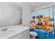 bathroom with Paw Patrol shower curtain and white vanity at 458 Pender Woods Dr, Summerville, SC 29486