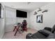 Cozy bedroom with a TV setup, gaming chair, and comfortable sofa at 458 Pender Woods Dr, Summerville, SC 29486