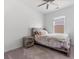 Cozy bedroom with rustic wood furnishings, a ceiling fan, and a window with natural light at 458 Pender Woods Dr, Summerville, SC 29486