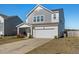Charming two-story home with a two-car garage and manicured lawn at 458 Pender Woods Dr, Summerville, SC 29486