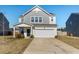 Charming two-story home featuring a covered porch and an attached two-car garage at 458 Pender Woods Dr, Summerville, SC 29486