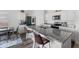 Well-lit kitchen showcasing granite counters, stainless steel appliances, and modern bar stools at 458 Pender Woods Dr, Summerville, SC 29486