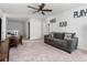Comfortable living room featuring a sofa, ceiling fan and carpeting at 458 Pender Woods Dr, Summerville, SC 29486