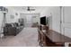 Spacious living room with ceiling fan, TV, sofa, play area, and neutral carpeting at 458 Pender Woods Dr, Summerville, SC 29486