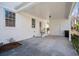 View of a large covered back porch with white brick walls and concrete floor at 511 Sarah St, Charleston, SC 29407