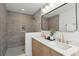 Bathroom with walk-in shower, double vanity, and modern finishes at 511 Sarah St, Charleston, SC 29407
