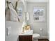 Bright bathroom with a white countertop, gold faucet and gold framed mirror and towel rack at 511 Sarah St, Charleston, SC 29407