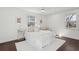 Bright bedroom featuring a white bed, large windows, and neutral decor at 511 Sarah St, Charleston, SC 29407