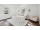 Bright bedroom with hardwood floors, large windows, and a cozy sitting area at 511 Sarah St, Charleston, SC 29407