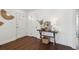 Inviting entryway featuring hardwood floors, a stylish console table with decor, a mirror and a front door at 511 Sarah St, Charleston, SC 29407