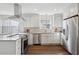 Modern kitchen featuring white cabinets, stainless steel appliances, hardwood floors and ample countertop space at 511 Sarah St, Charleston, SC 29407