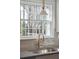 Bright kitchen featuring a stainless steel sink, tile backsplash, and a window providing natural light at 511 Sarah St, Charleston, SC 29407