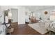 Open-concept living space with hardwood floors, views of the dining area, and comfortable seating arrangements at 511 Sarah St, Charleston, SC 29407