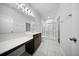 Modern bathroom with dual sinks, a large mirror, and a glass-enclosed shower at 523 Eastern Isle Ave, Summerville, SC 29486