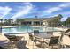 Relax poolside with plenty of seating and tables; enjoy the community's beautiful swimming pool on a sunny day at 523 Eastern Isle Ave, Summerville, SC 29486