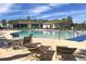 Enjoy the community pool featuring comfortable chaise lounges, chairs, and tables; relax and soak up the sun at 523 Eastern Isle Ave, Summerville, SC 29486
