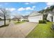 Charming single-story home featuring a two-car garage and well-maintained front lawn in a suburban neighborhood at 523 Eastern Isle Ave, Summerville, SC 29486