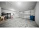 A spacious garage features a utility sink, shelving, and overhead door at 523 Eastern Isle Ave, Summerville, SC 29486
