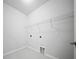 Bright laundry room featuring tile floors and wire shelving at 523 Eastern Isle Ave, Summerville, SC 29486