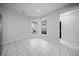 The living room has tile floors and large windows that provide natural light at 523 Eastern Isle Ave, Summerville, SC 29486