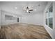 Open-concept living area featuring hardwood floors, recessed lighting, and a modern chandelier at 523 Eastern Isle Ave, Summerville, SC 29486