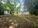 Expansive back yard featuring a shed and mature trees providing ample shade for outdoor enjoyment at 5273 Potomac St, North Charleston, SC 29405
