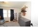 Bedroom featuring a gray dresser, dark curtains, and mounted skateboards, creating a unique and modern look at 5273 Potomac St, North Charleston, SC 29405
