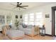 Bright and airy living room features large windows, modern furnishings, and ample natural light at 5273 Potomac St, North Charleston, SC 29405
