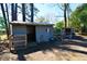 Outdoor shed with open door surrounded by tools and equipment in the backyard at 5273 Potomac St, North Charleston, SC 29405