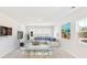 Spacious bonus room with plush carpeting, modern furniture, large windows, and a coastal-themed painting at 550 Richfield Way, Summerville, SC 29486