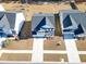 Aerial view of a home's exterior, surrounded by neatly manicured lawns and driveways at 573 Yellow Leaf Ln, Summerville, SC 29486