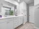 Bright bathroom with a double sink vanity, spacious mirror, and tile flooring at 573 Yellow Leaf Ln, Summerville, SC 29486