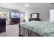 Bright bedroom featuring large windows, a TV over a fireplace, and a dark wood dresser at 573 Yellow Leaf Ln, Summerville, SC 29486
